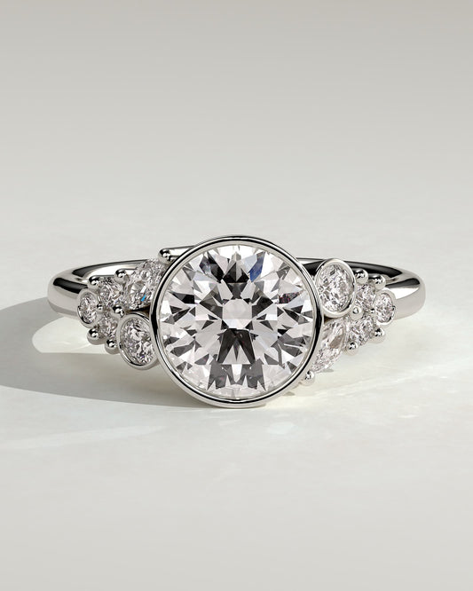 Alessia - Round Bezel Solitaire with Clustered Round-Marquise Mixed Set Shoulder Stones Engagement Ring - Platinum - platinum - Lara Jewels