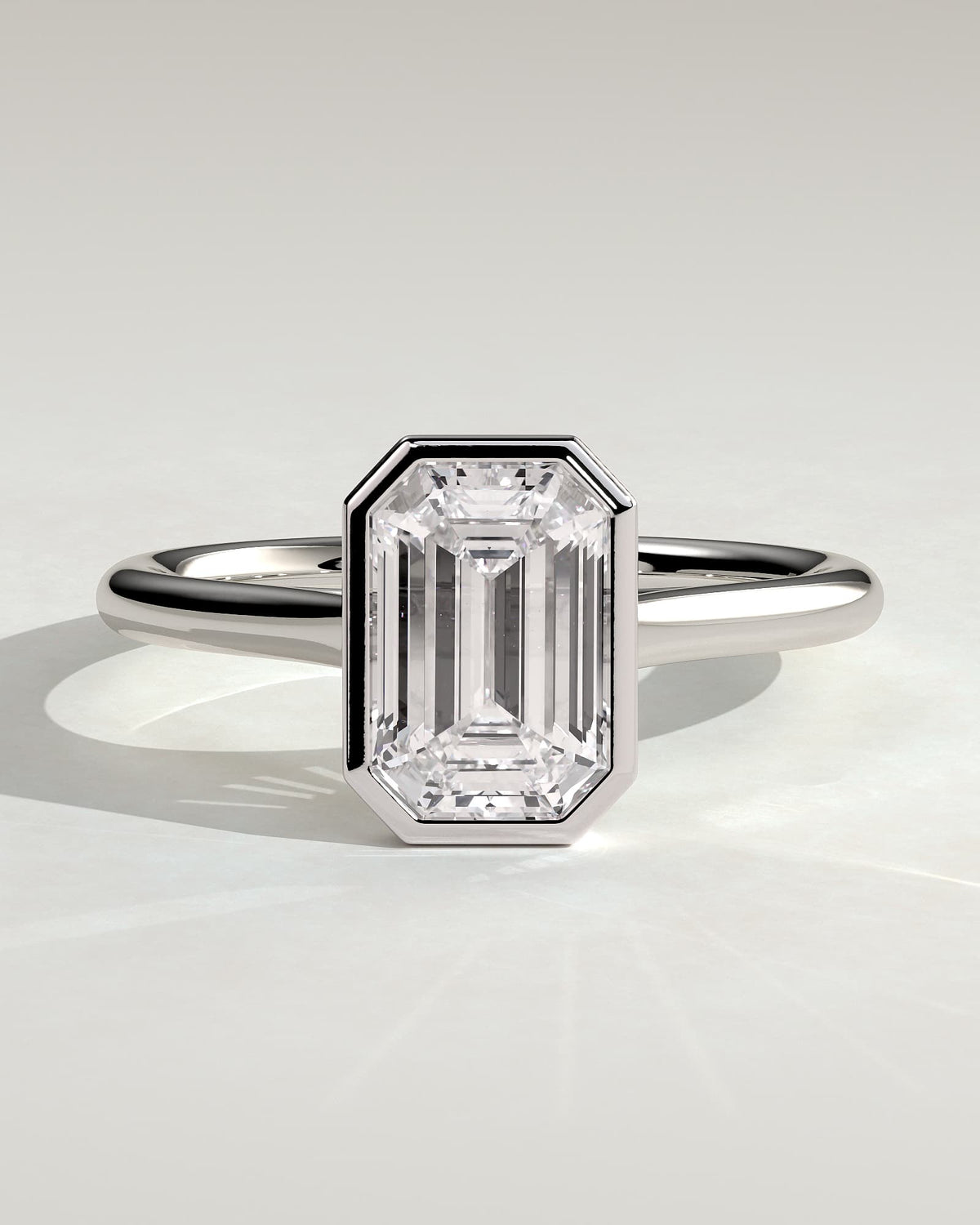 Imani - Emerald Bezel Solitaire with Cathedral High Setting Engagement Ring - White Gold