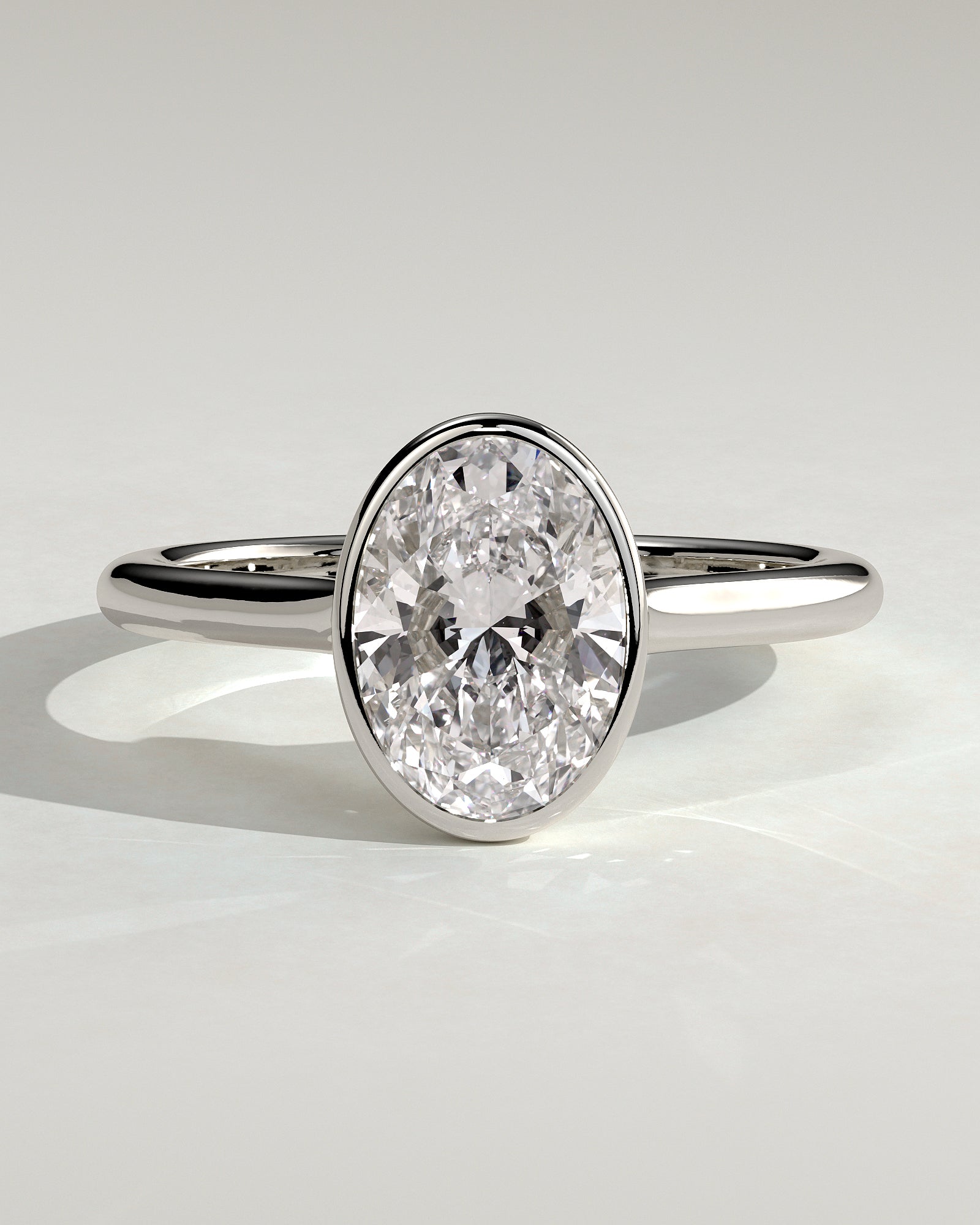 Gemma - Oval Bezel Solitaire with Twisted Gallery Engagement Ring - Platinum - White Gold / Platinum 2ct