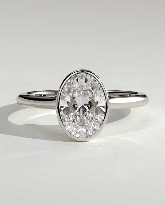 Gemma - Oval Bezel Solitaire with Twisted Gallery Engagement Ring - Platinum