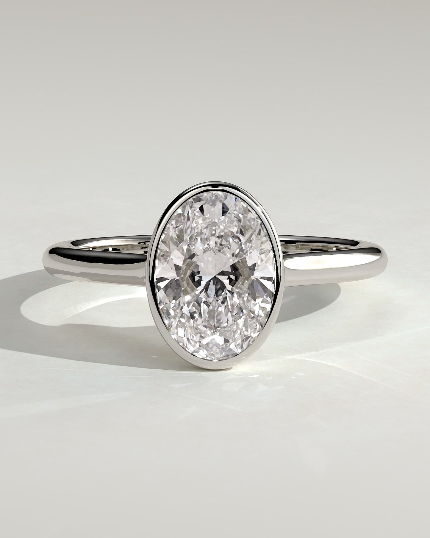 Gemma - Oval Bezel Solitaire with Twisted Gallery Engagement Ring - White Gold