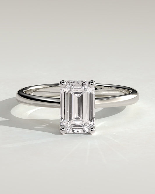 Freya - Emerald Claw Solitaire with Tapered Band and Cathedral Low Setting Engagement Ring - Platinum