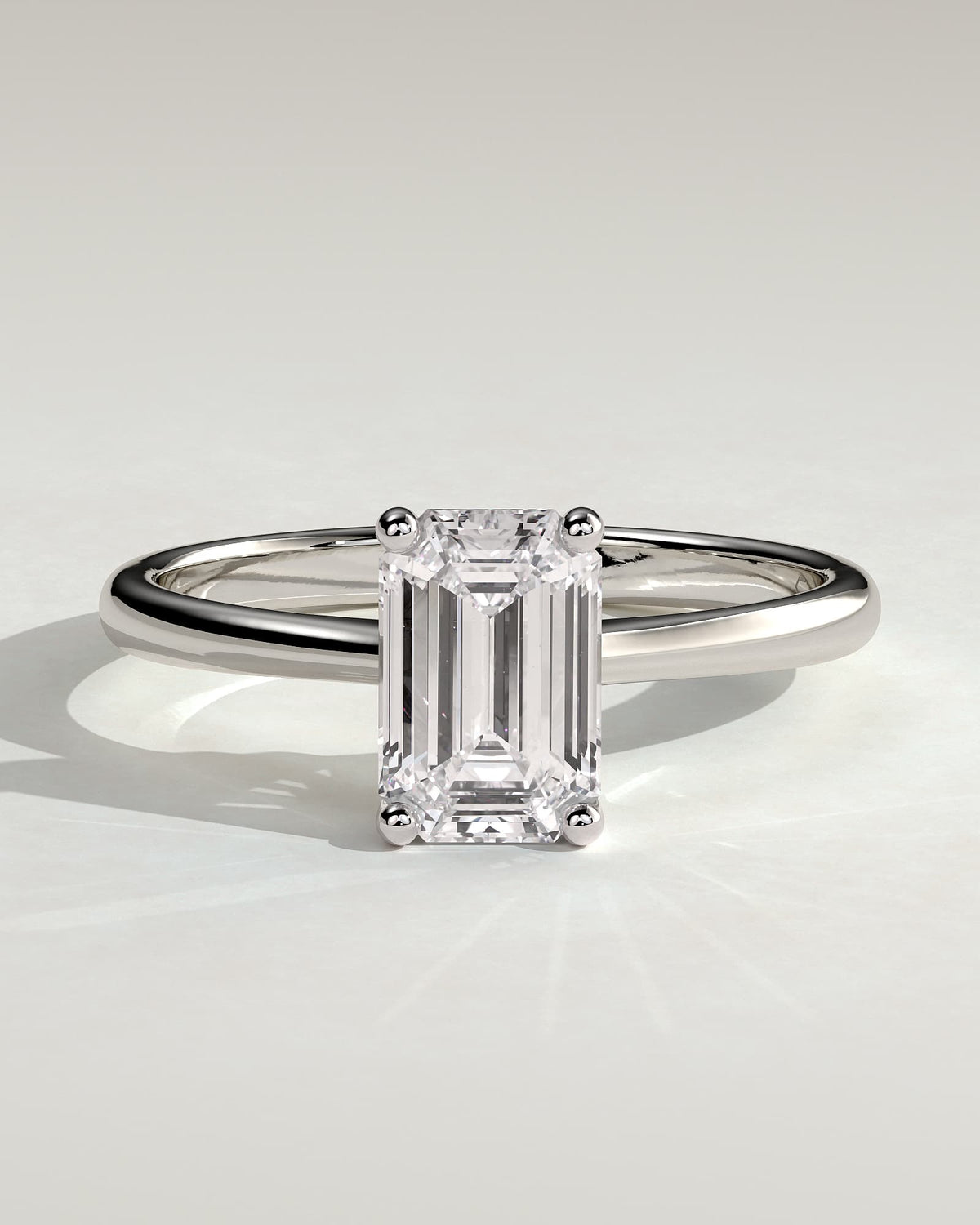 Freya - Emerald Claw Solitaire with Tapered Band and Cathedral Low Setting Engagement Ring - White Gold