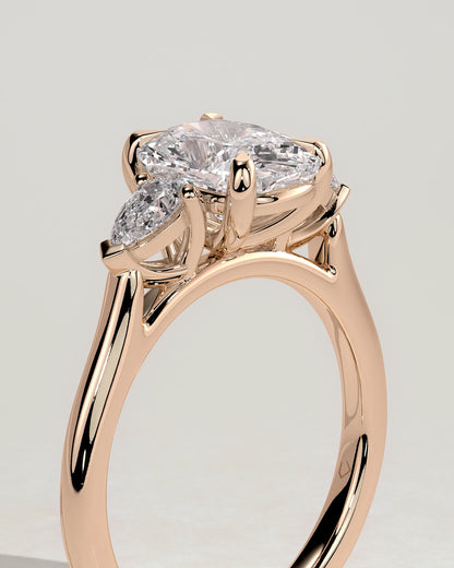 Cataleya - Elongated Cushion Claw Trilogy with Pear Side Stones and Cathedral Setting Engagement Ring - Rose Gold