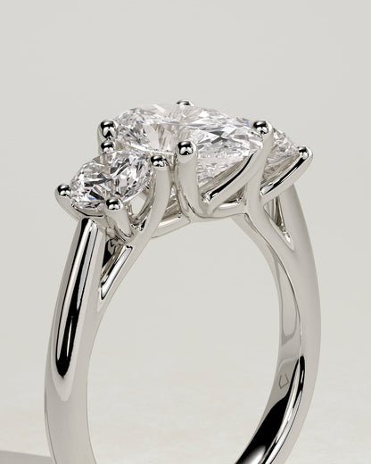 Grace - Oval Claw Trilogy with Round Side Stones, Open Trellis Gallery and Tapered Band Engagement Ring - Platinum