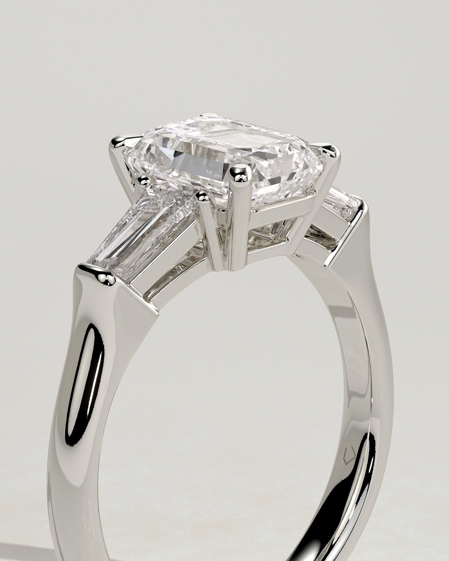 Bridget - Emerald Claw Trilogy with Tapered Baguette Side Stones and Cathedral Setting Engagement Ring - Platinum