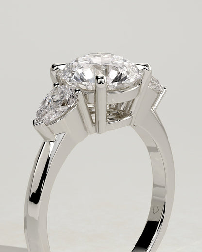 Halle - Round Claw Trilogy with Pear Side Stones and Knife Edge Band Engagement Ring - White Gold