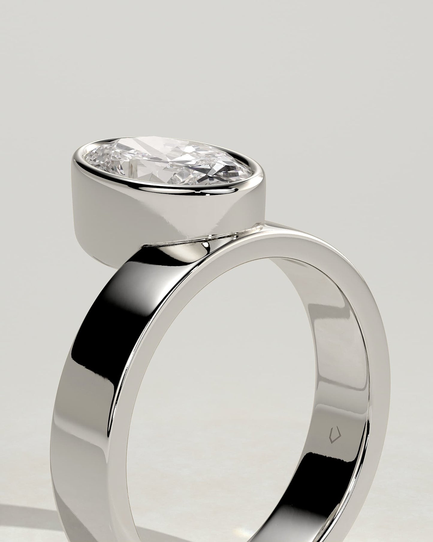 Carmen - Oval Bezel Solitaire with Offset Setting and Flat Cigar Band Engagement Ring - White Gold