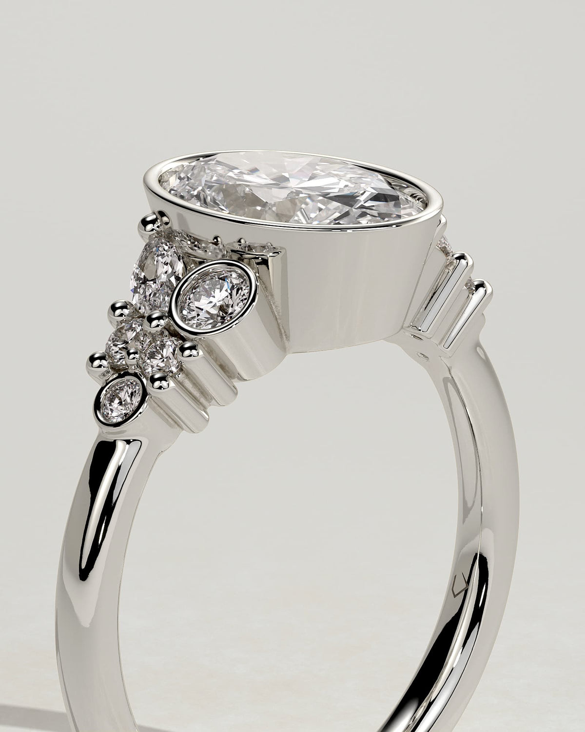 Isabella - Oval Bezel Solitaire with Clustered Round-Marquise Mixed Set Shoulder Stones Engagement Ring - White Gold