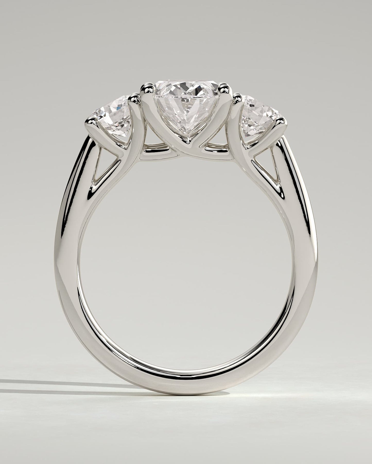 Grace - Oval Claw Trilogy with Round Side Stones, Open Trellis Gallery and Tapered Band Engagement Ring - White Gold
