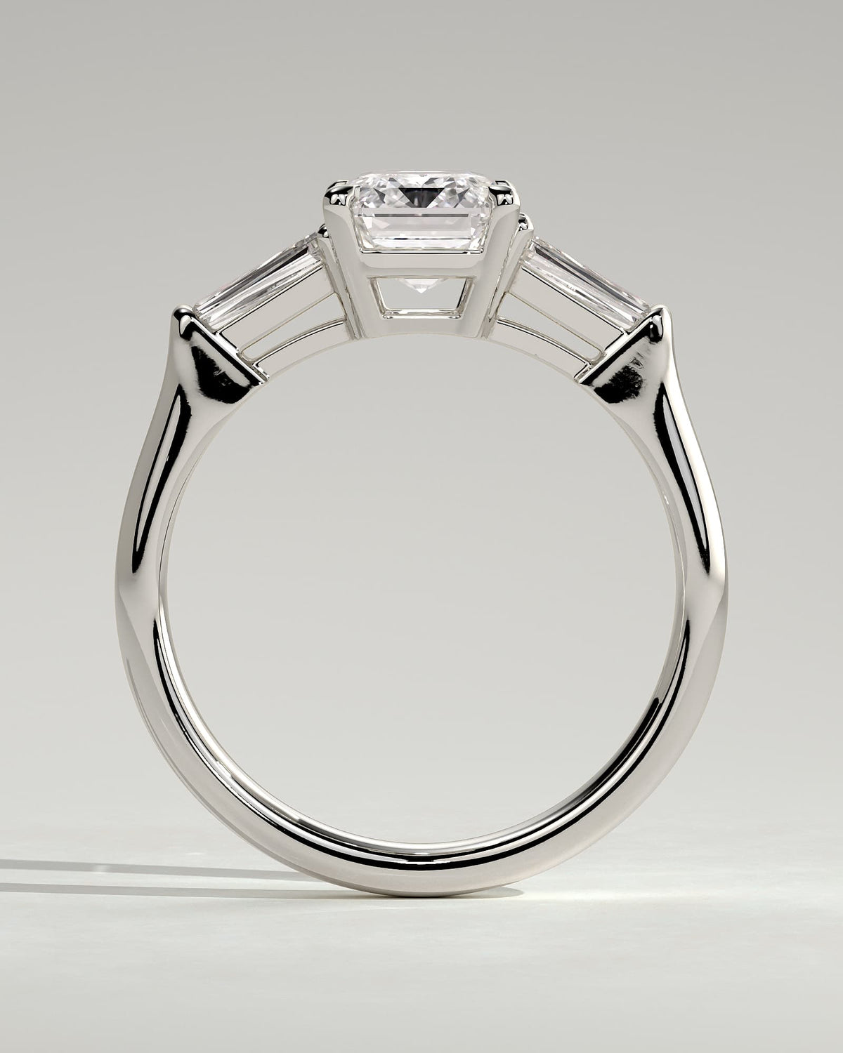 Bridget - Emerald Claw Trilogy with Tapered Baguette Side Stones and Cathedral Setting Engagement Ring - Platinum