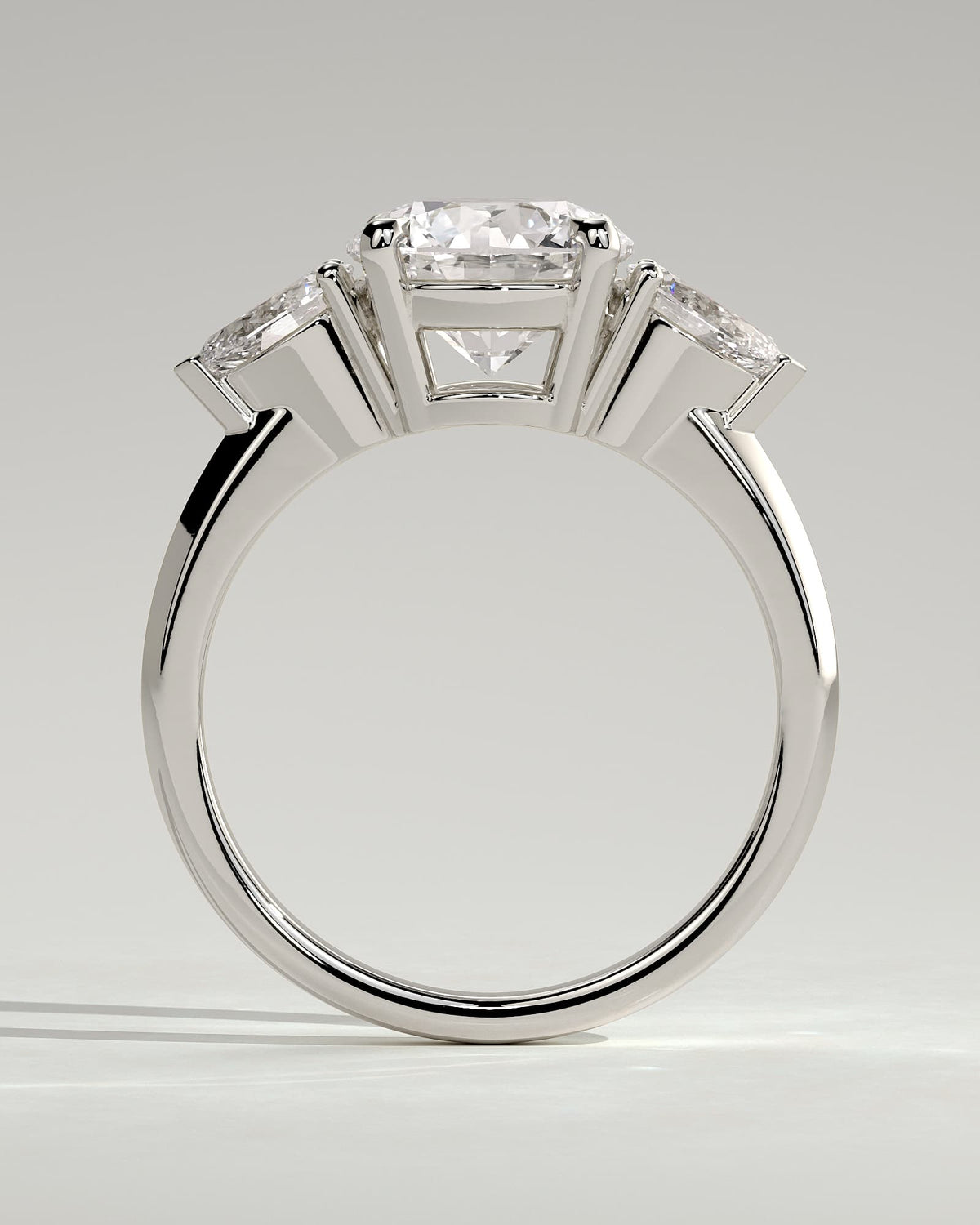 Halle - Round Claw Trilogy with Pear Side Stones and Knife Edge Band Engagement Ring - White Gold