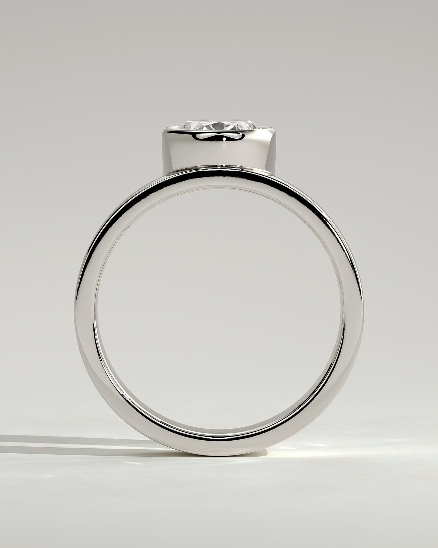 Carmen - Oval Bezel Solitaire with Offset Setting and Flat Cigar Band Engagement Ring - White Gold