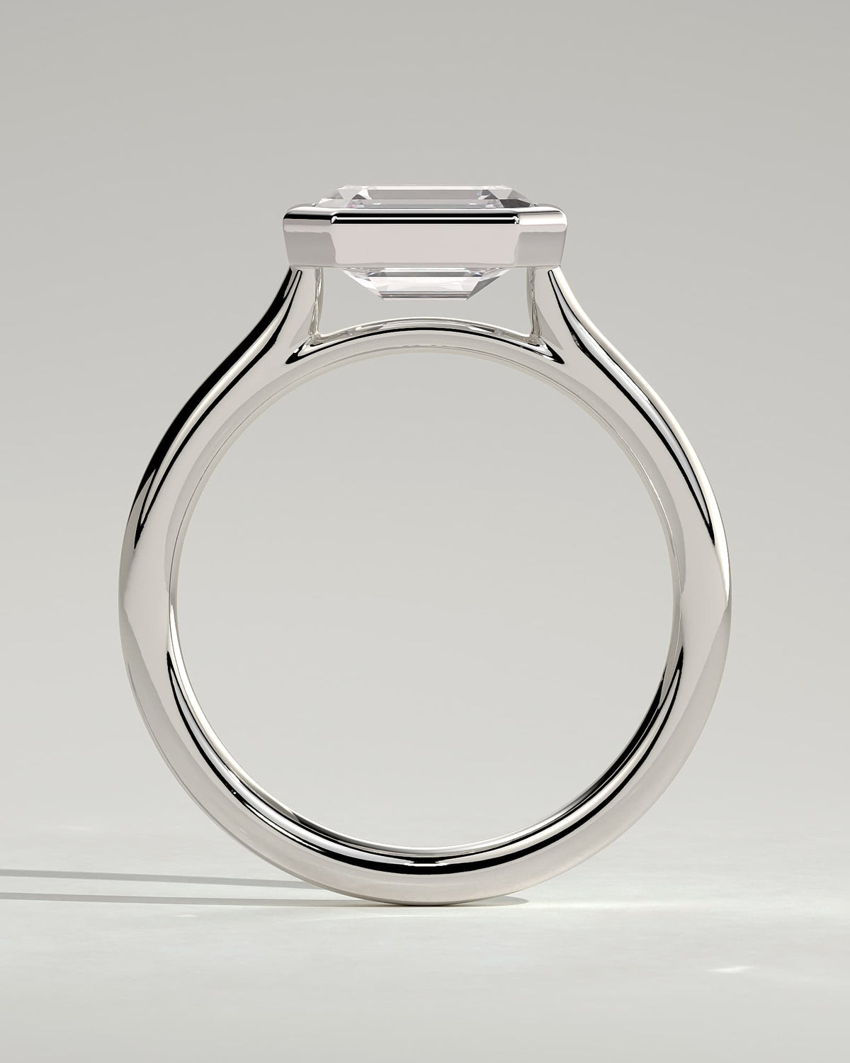 Olive - Statement Emerald East West Bezel Solitaire with Open Cathedral High Setting Engagement Ring - Platinum