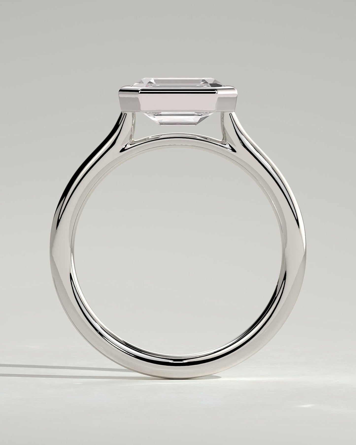 Olive - Statement Emerald East West Bezel Solitaire with Open Cathedral High Setting Engagement Ring - White Gold