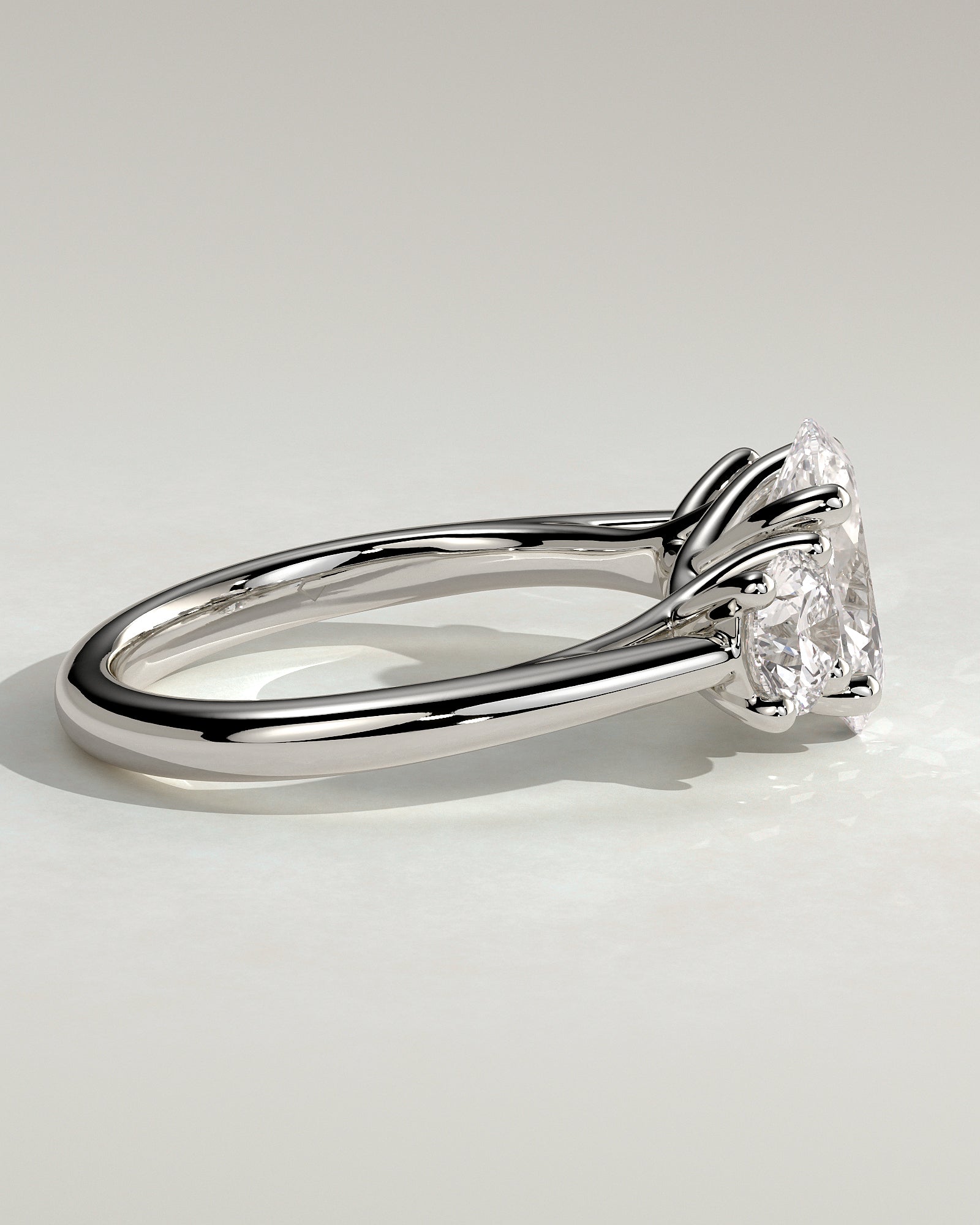 Grace - Oval Claw Trilogy with Round Side Stones, Open Trellis Gallery and Tapered Band Engagement Ring - Platinum - White Gold / Platinum 2ct
