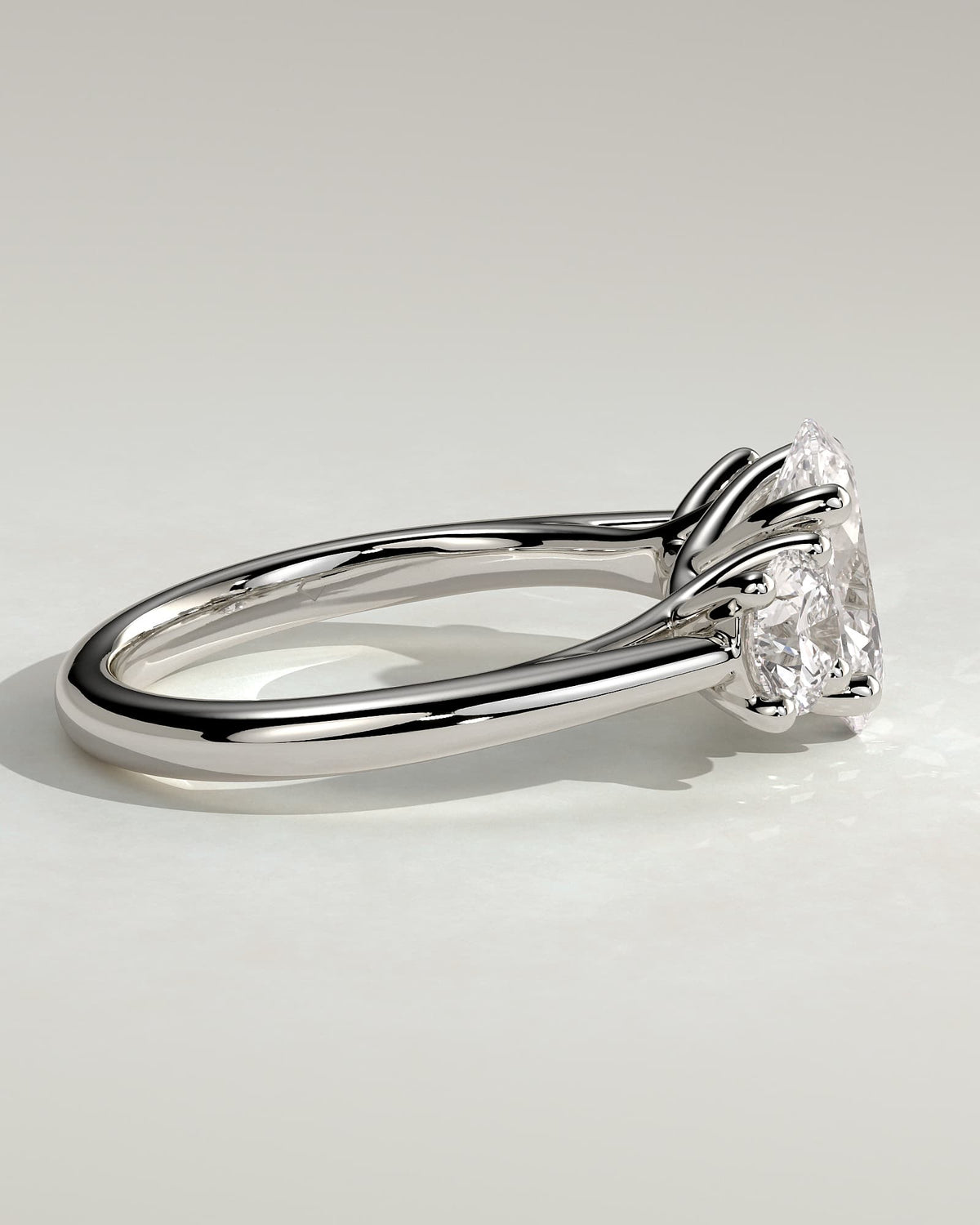 Grace - Oval Claw Trilogy with Round Side Stones, Open Trellis Gallery and Tapered Band Engagement Ring - White Gold