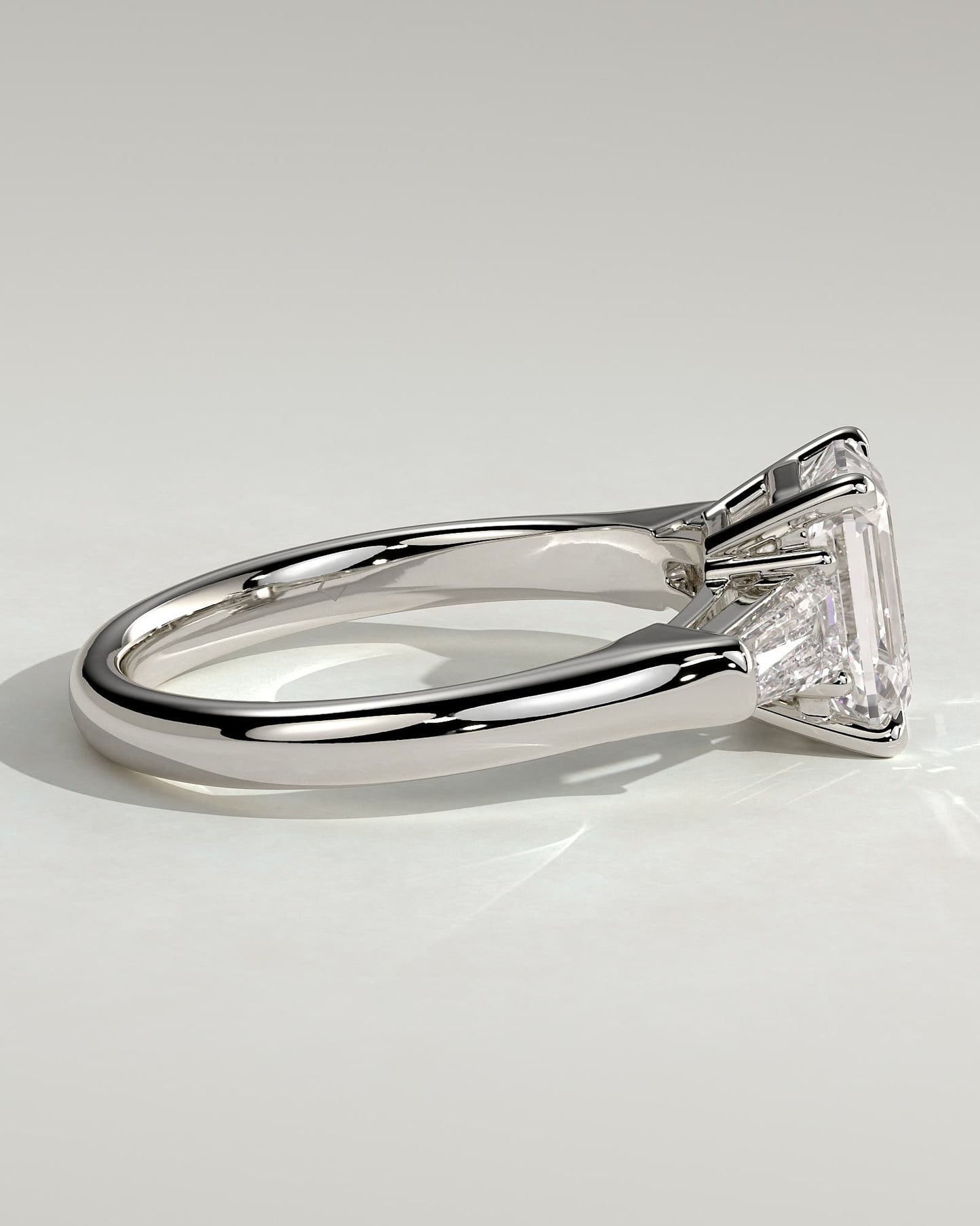 Bridget - Emerald Claw Trilogy with Tapered Baguette Side Stones and Cathedral Setting Engagement Ring - Platinum