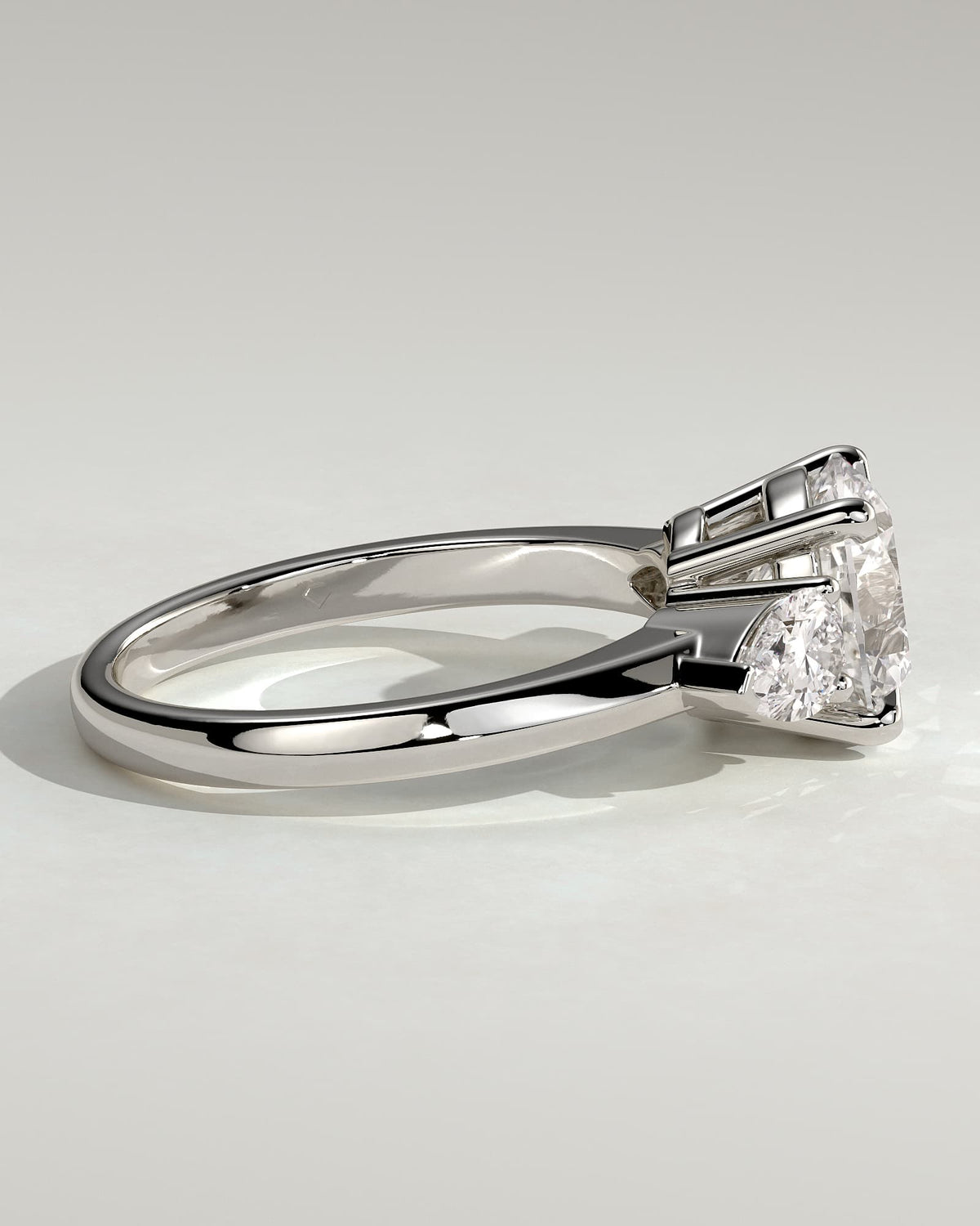 Halle - Round Claw Trilogy with Pear Side Stones and Knife Edge Band Engagement Ring - White Gold