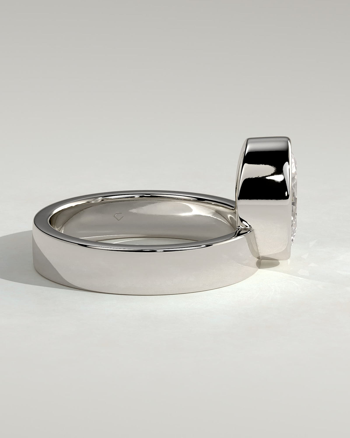 Carmen - Oval Bezel Solitaire with Offset Setting and Flat Cigar Band Engagement Ring - White Gold