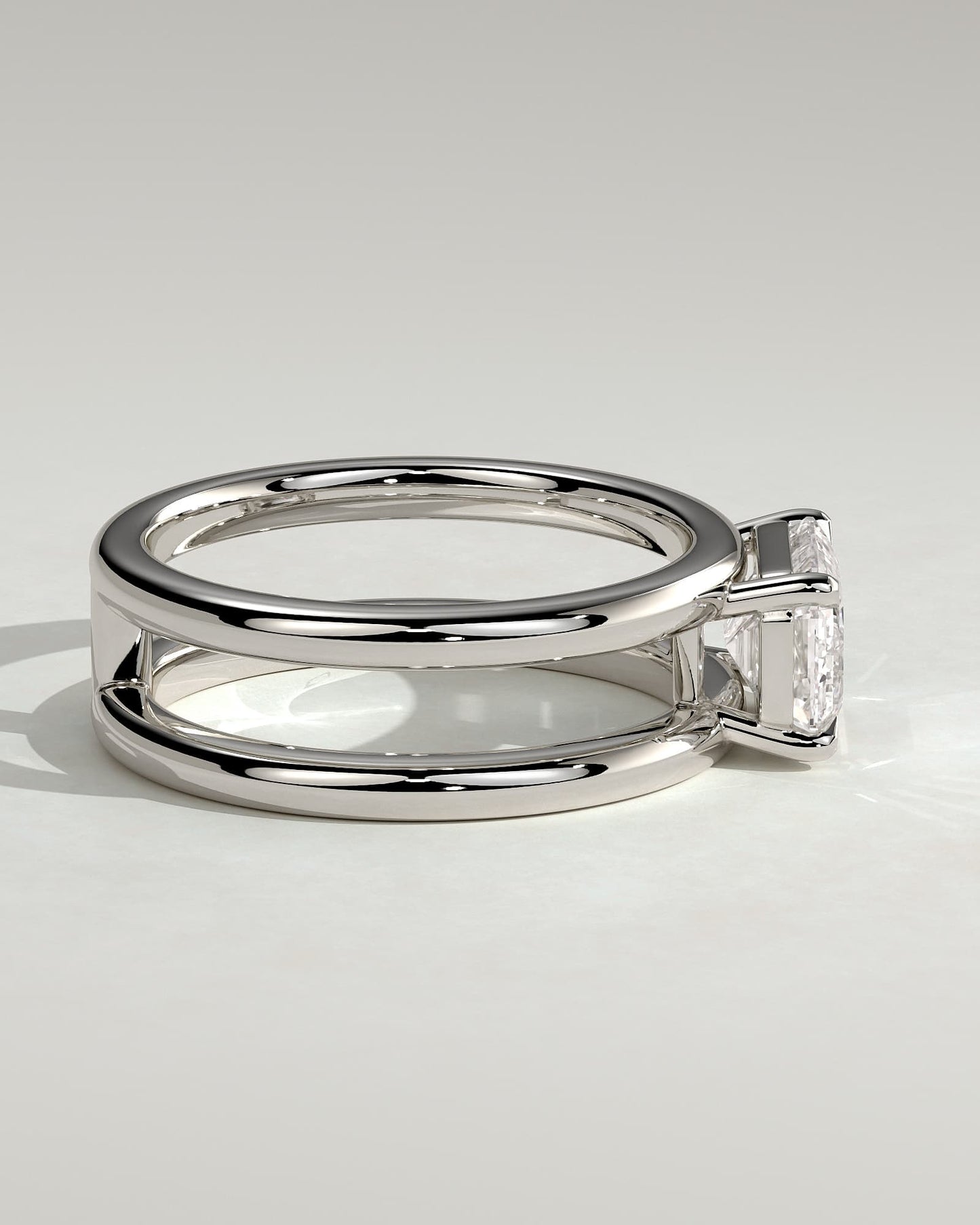 Devon - Emerald East West Claw Solitaire with Spaced Double Band Engagement Ring - Platinum