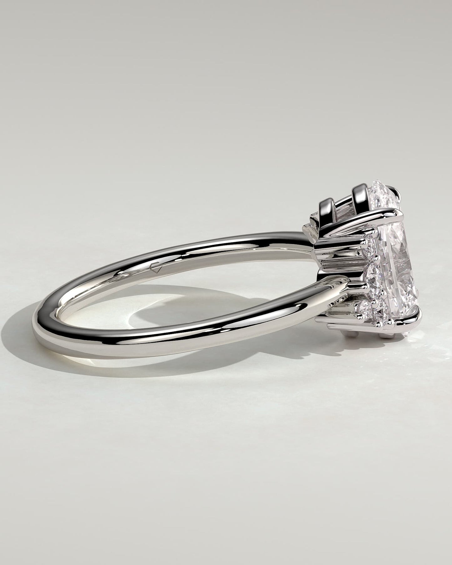 Esther - Oval Claw Solitaire with Clustered Round Opposing Shoulder Stones Engagement Ring - White Gold