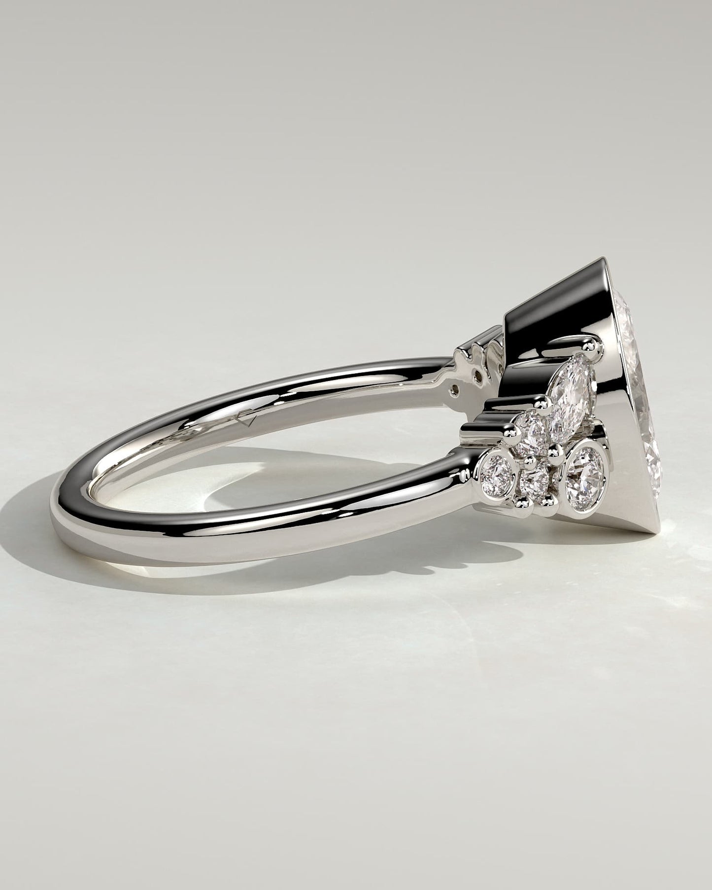 Isabella - Oval Bezel Solitaire with Clustered Round-Marquise Mixed Set Shoulder Stones Engagement Ring - White Gold