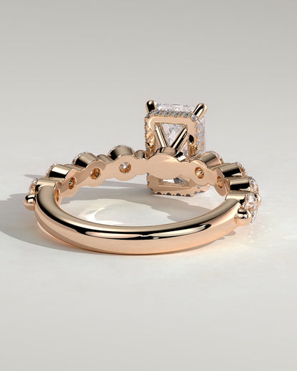 Josephine - Radiant Claw Solitaire with Round Accent Stones and Wrap Around Hidden Halo Engagement Ring - Rose Gold