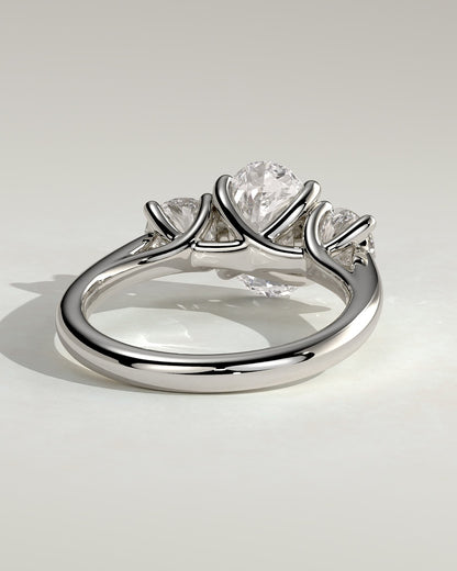 Grace - Oval Claw Trilogy with Round Side Stones, Open Trellis Gallery and Tapered Band Engagement Ring - Platinum