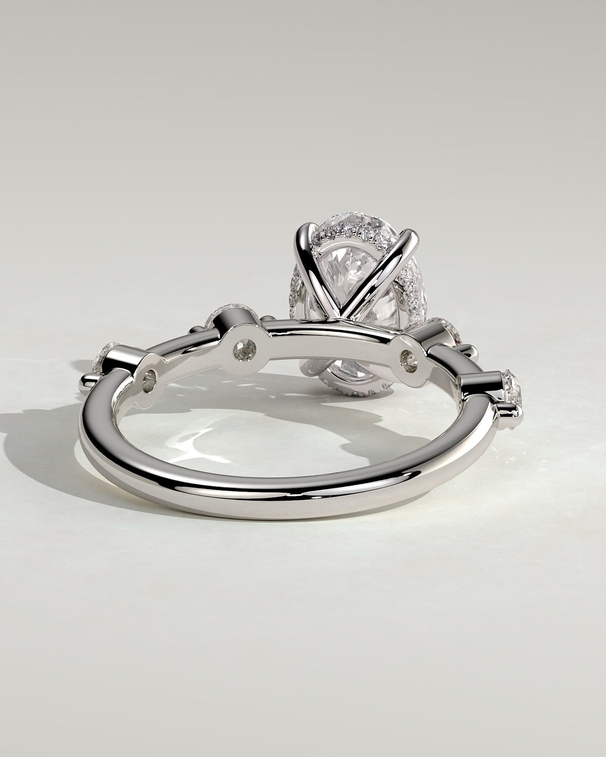 Arwen - Oval Claw Solitaire with 4 Spaced Round Accent Stones and Hidden Halo Engagement Ring - White Gold