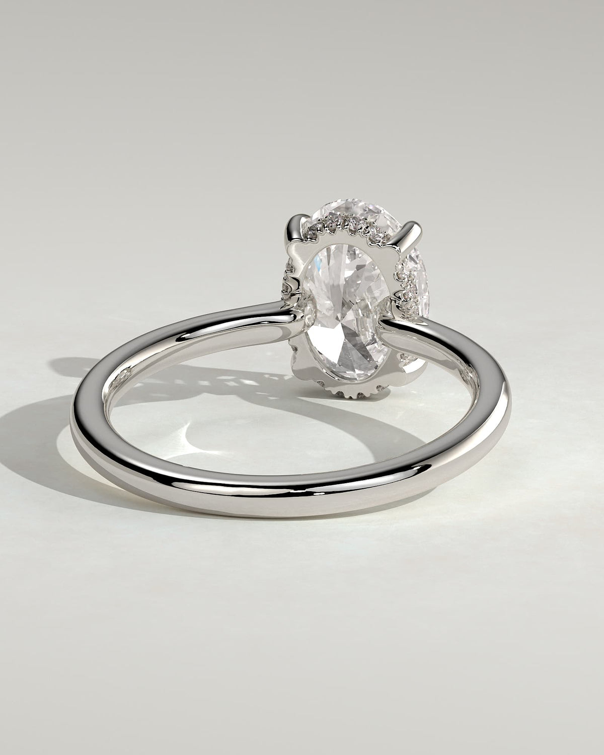 Kiana - Oval Claw Solitaire with Hidden Halo and Floating Cathedral Low Setting Engagement Ring - Platinum