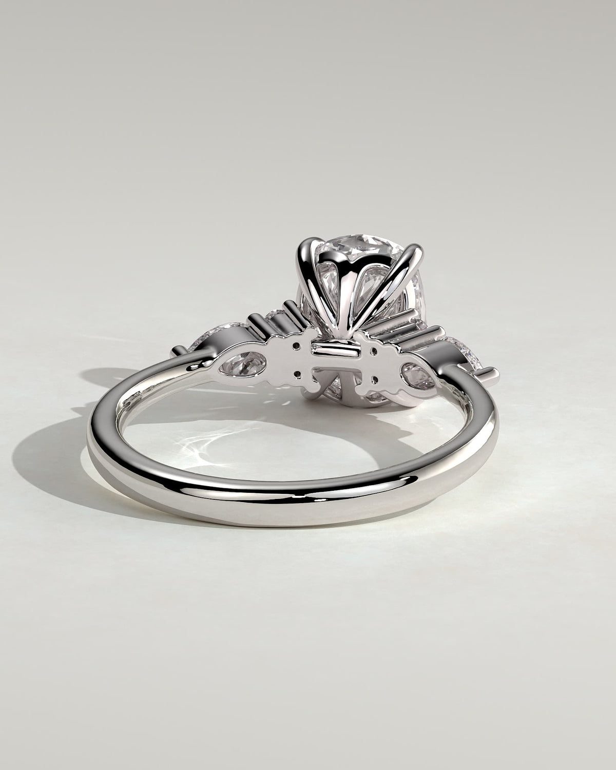 Sadie - Elongated Cushion Claw Solitaire with Pear Accents and Round Shoulder Stones Engagement Ring - Platinum