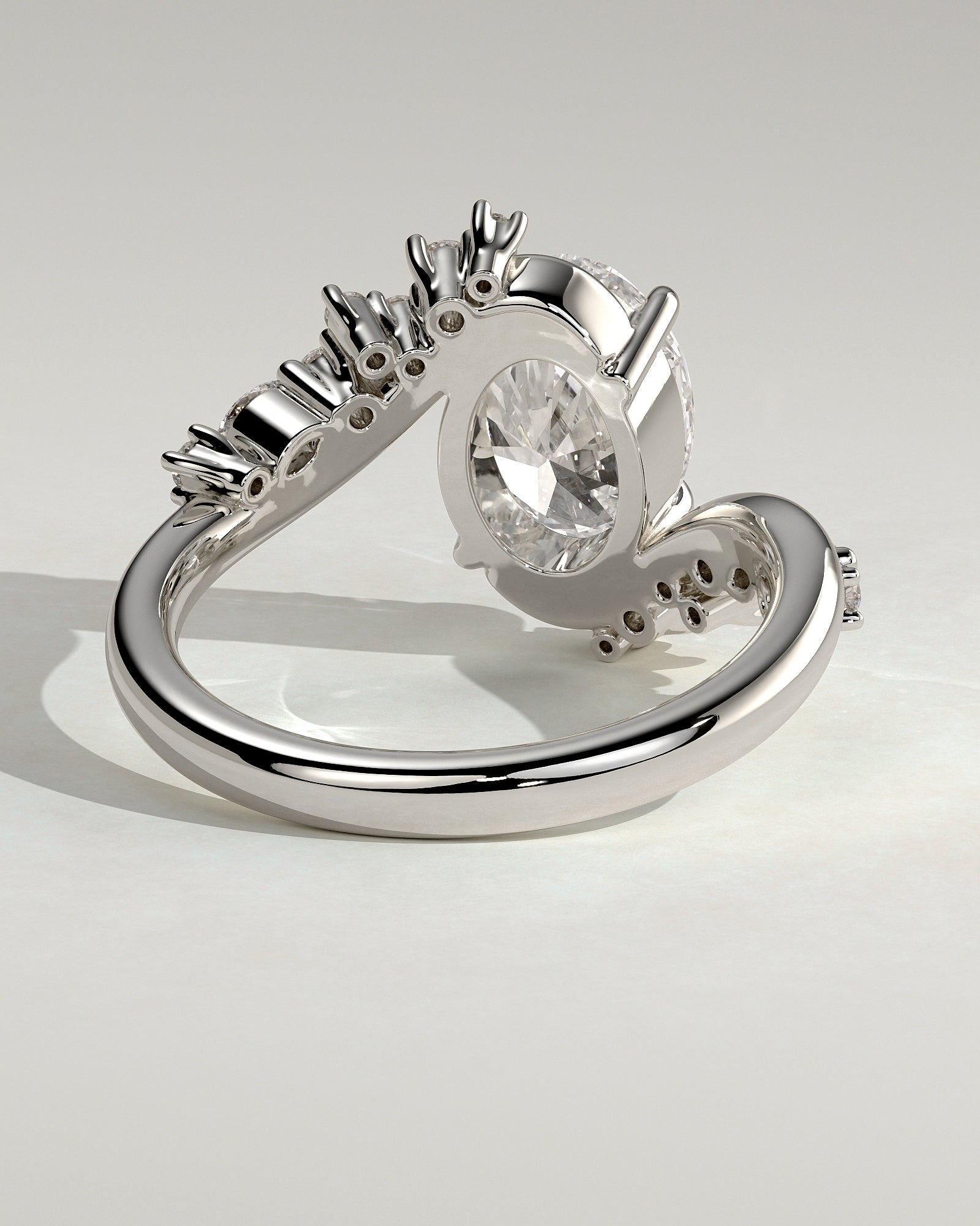 Ezmerelda - Oval Claw Solitaire with Bypass Band and Clustered Round-Marquise Accent Stones Engagement Ring - Platinum - White Gold / Platinum 2ct