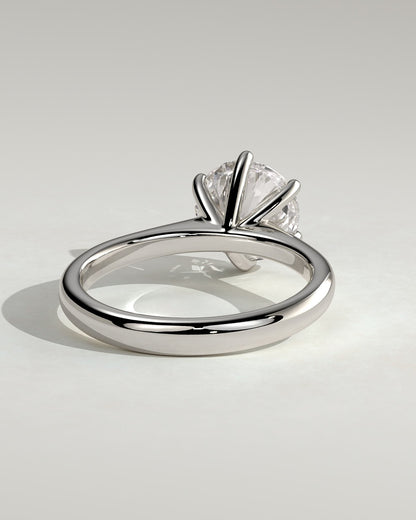 Jacqueline - Round Claw Solitaire with Solid Cathedral Low Setting Engagement Ring - White Gold