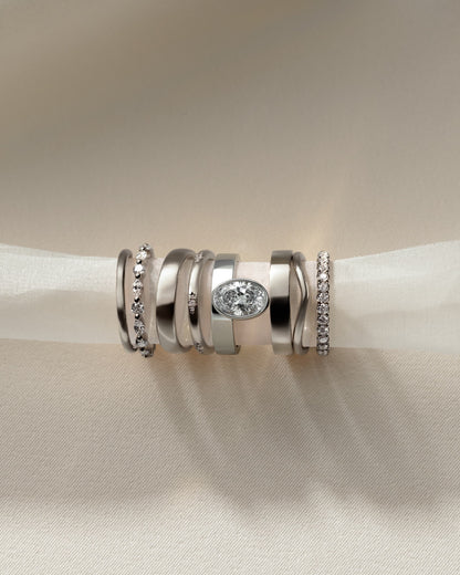 Carmen - Oval Bezel Solitaire with Offset Setting and Flat Cigar Band Engagement Ring - White Gold