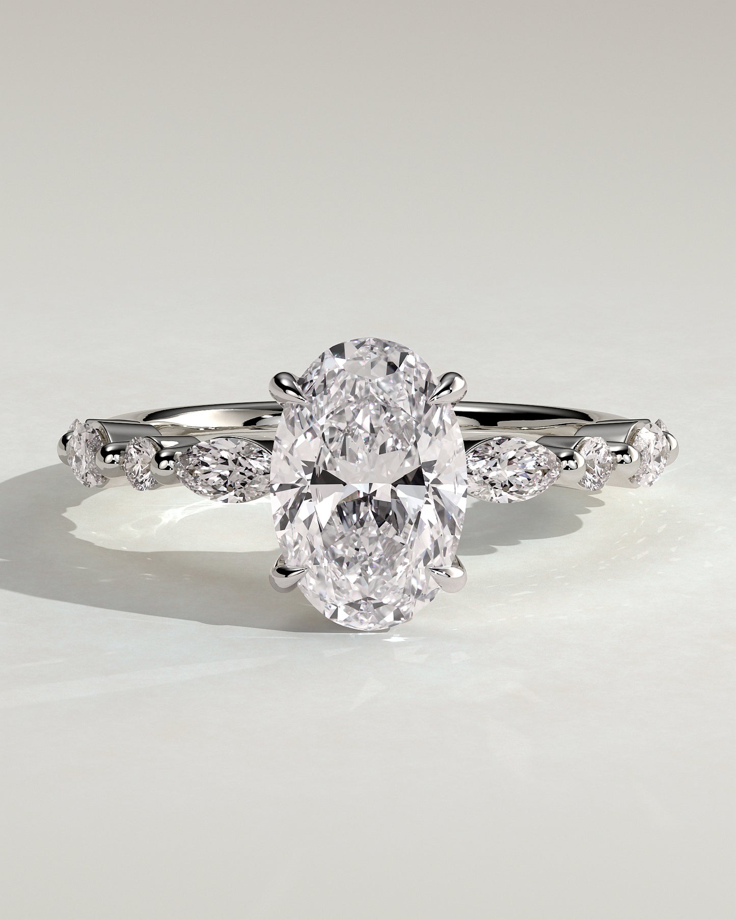 Alyssa - Oval Claw Solitaire with Marquise and Round Accent Stones Engagement Ring - Platinum - White Gold / Platinum 2ct