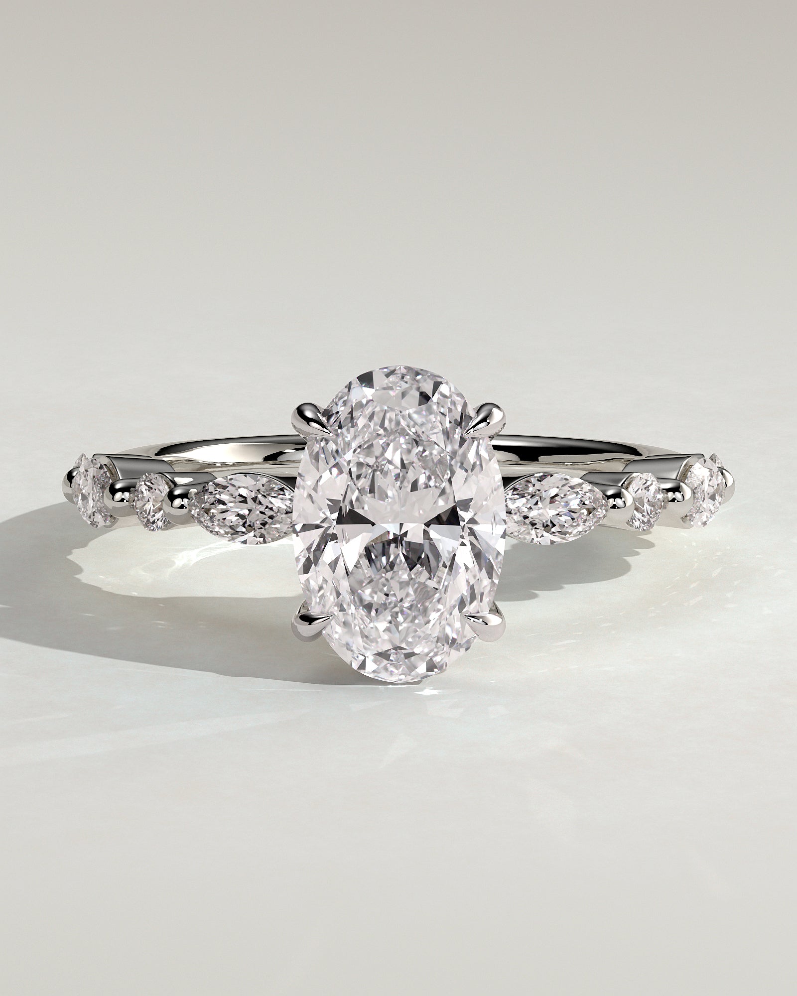 Alyssa - Oval Claw Solitaire with Marquise and Round Accent Stones Engagement Ring - Platinum - White Gold / Platinum 2ct