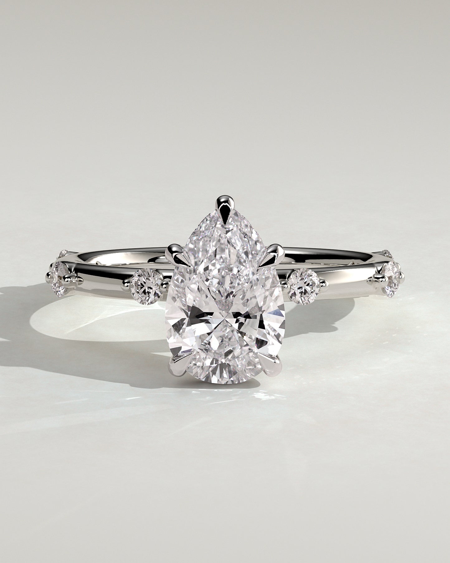 Amora - Pear Claw Solitaire with 6 Spaced Round Accent Stones and Hidden Halo Engagement Ring - Platinum - White Gold / Platinum 2ct