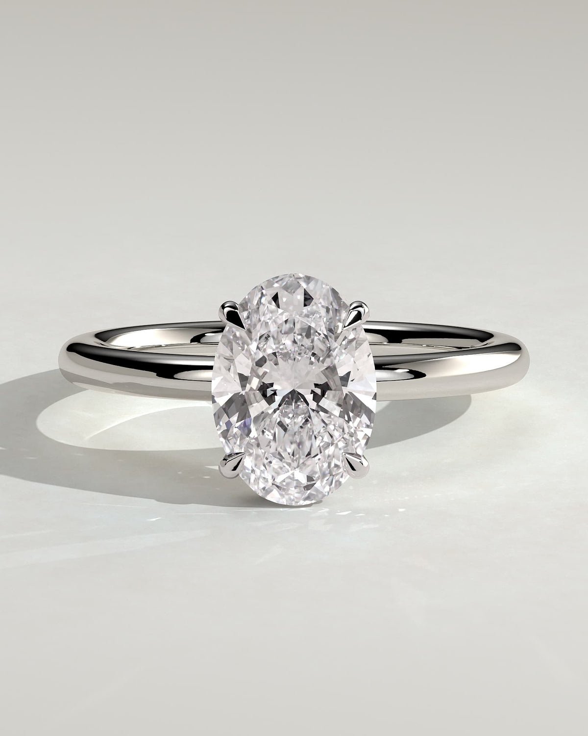 Cecilia - Oval Claw Solitaire with Wrap Around Hidden Halo Engagement Ring - White Gold