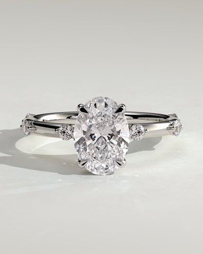 Elise - Oval Claw Solitaire with 6 Spaced Round Accent Stones and Hidden Halo Engagement Ring - White Gold