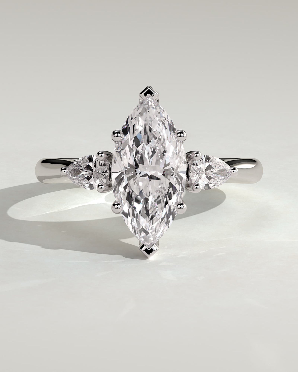 Hannah - Marquise Claw Trilogy with Pear Side Stones and Hidden Halo Engagement Ring - White Gold