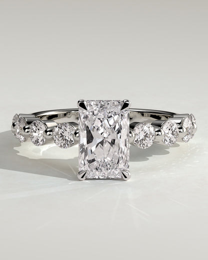 Josephine - Radiant Claw Solitaire with Round Accent Stones and Wrap Around Hidden Halo Engagement Ring - White Gold