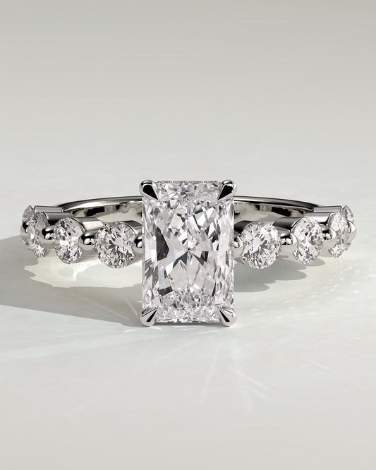 Josephine - Radiant Claw Solitaire with Round Accent Stones and Wrap Around Hidden Halo Engagement Ring - Platinum