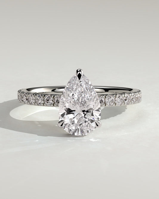 Keira - Pear Claw Solitaire with Wrap Around Hidden Halo and Pave Band Engagement Ring - White Gold