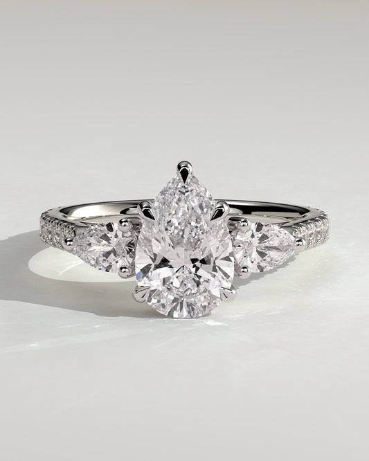 Mia - Pear Claw Trilogy with Pear Side Stones, Pave Band and Cathedral High Setting Engagement Ring - Platinum