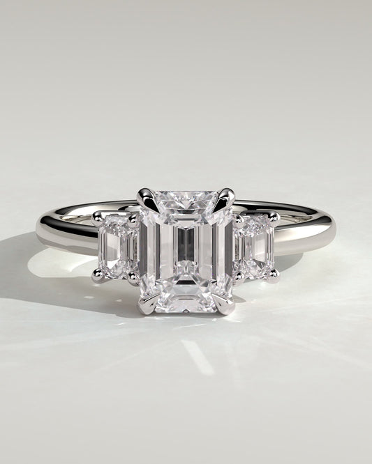 Silvana - Emerald Claw Trilogy with Emerald Side Stones and Low Setting Engagement Ring - Platinum