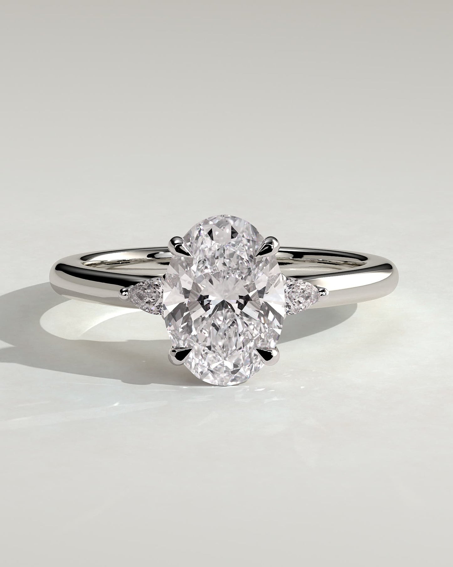 Elena - Oval Claw Trilogy with Pear Side Stones and Tulip Detail Engagement Ring - White Gold