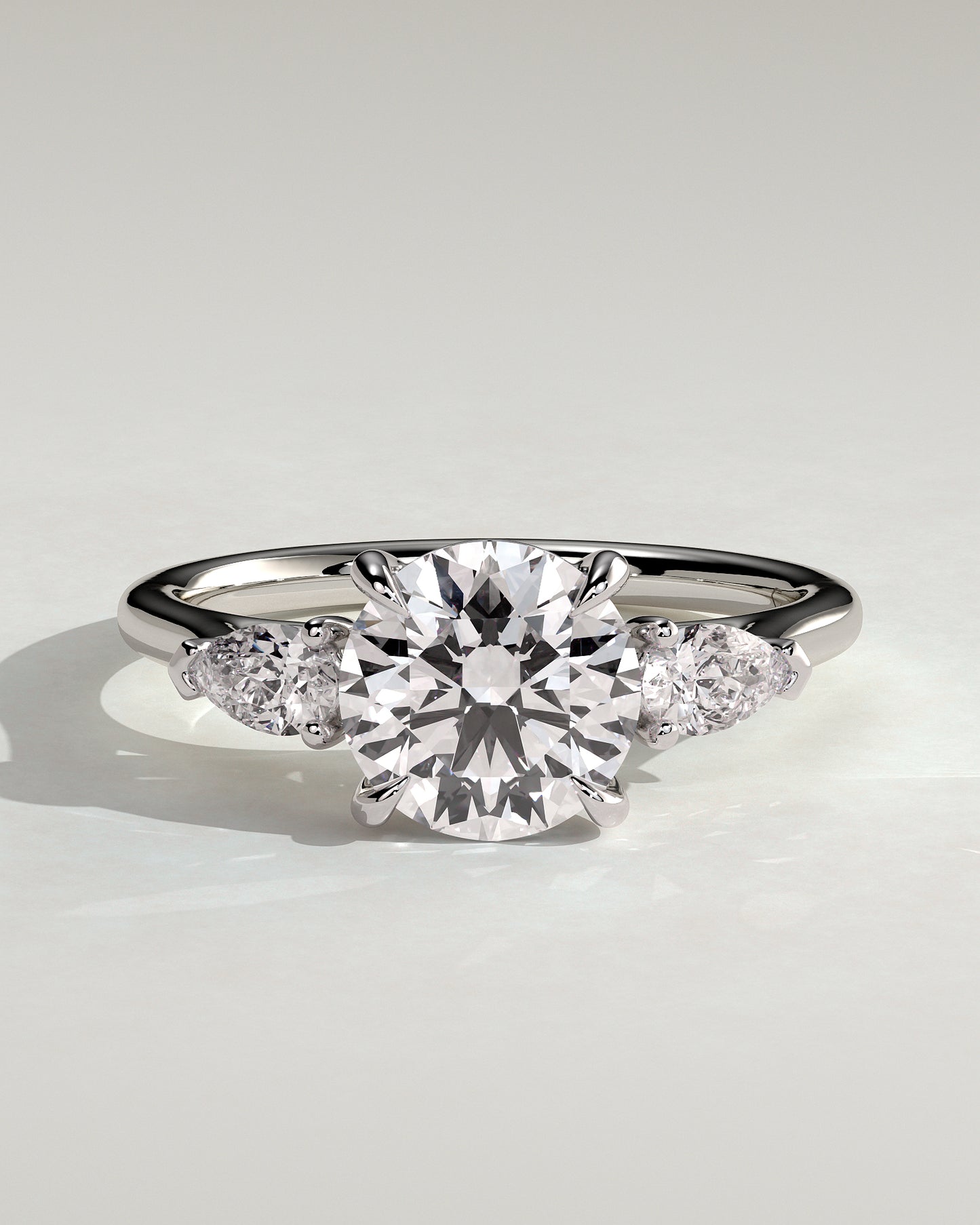 Arya - Round Claw Trilogy with Pear Side Stones and Cathedral Setting Engagement Ring - Platinum - White Gold / Platinum 2ct