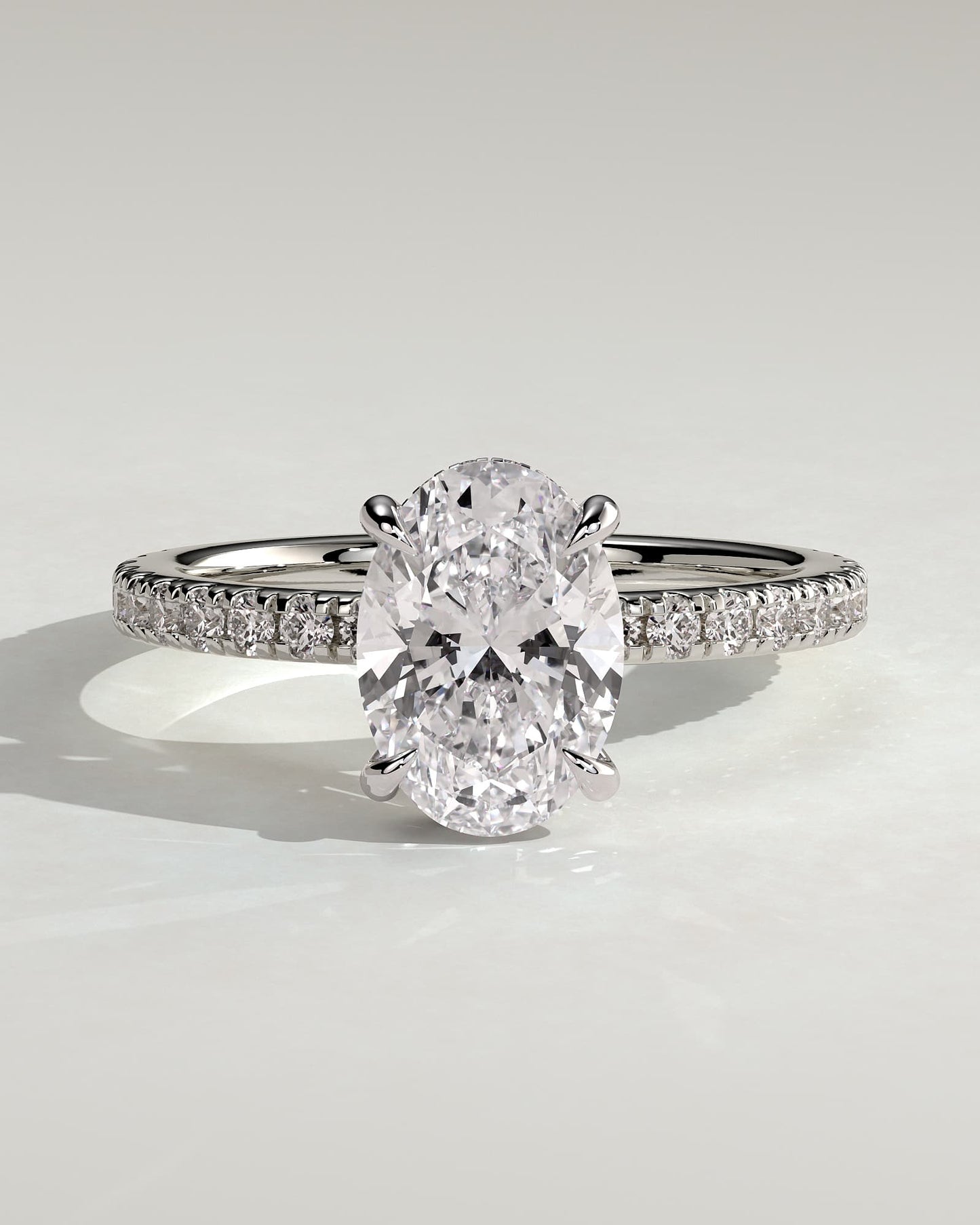 Evangeline - Oval Claw Solitaire with Wrap Around Hidden Halo and Pave Band Engagement Ring - White Gold