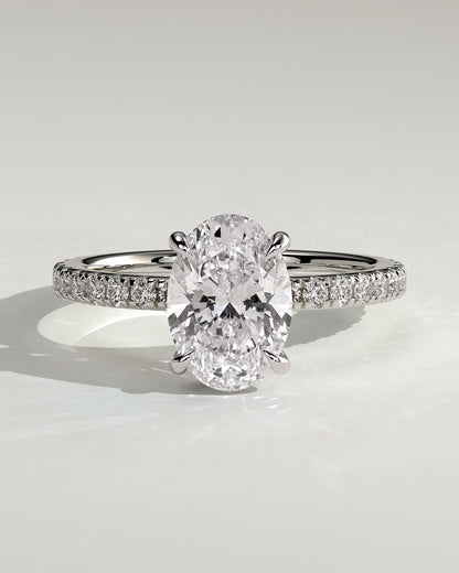 Evangeline - Oval Claw Solitaire with Wrap Around Hidden Halo and Pave Band Engagement Ring - White Gold